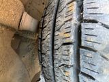 a close up of a tire on the side of the road