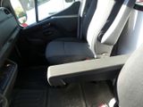 a seat in the back of a van with a cup holder
