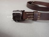 a belt that has a buckle on it on a table