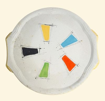 a white plate with a multicolored design on it