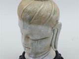 statue of a woman with a bun on her head