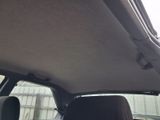 a view of a car ' s sunroof from the inside