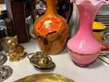 many vases and other decorative items on the table