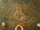 a close up view of a metal object with a gold ring on it