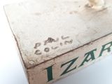 a small box with a lid that has a picture of a lizard on it