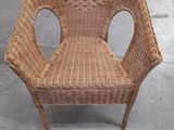 a wicker chair that is sitting on the floor
