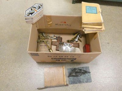 a box with a bunch of items in it on the floor