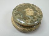 a picture of a stone box on a white surface