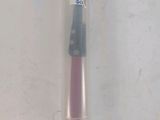 a toothbrush that is in a plastic container