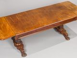 an old wooden table with two legs and a wooden top