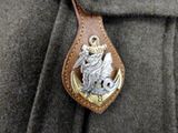 a leather keychain with a picture of a knight on it