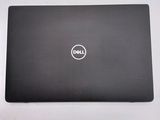 the dell laptop is sitting on a table with a white background
