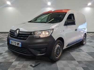 the white van is parked on a checkered floor in a room