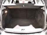a trunk of a car with the back door open