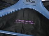 a blue hanger that has a black jacket on it