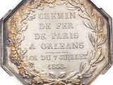 an image of a silver coin with a wreath on it