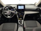 the interior of a small car with a steering wheel and dashboard
