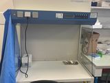 a desk with a chair and a computer on it