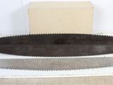 an old pair of saws sitting on top of a table