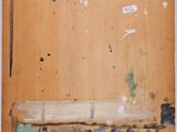 an image of a painting on a piece of wood with a tag on it