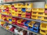 many bins of assorted items on the shelves
