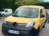 yellow and black van parked in a parking lot next to other cars