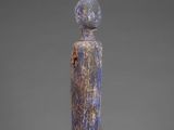 a sculpture of a woman with a head on her head