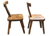 pair of wooden chairs on a white background with a white background