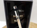 a picture of a lighter in a box on a table