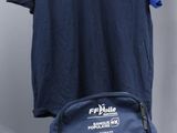 a backpack and a t - shirt hanging on a hanger