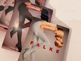 several cards with a picture of a woman in tights and stockings on them