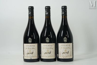 three bottles of wine sitting on top of a white table