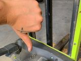 a hand that is pushing a fork on a pallet