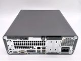 the back view of a computer with a hard drive on top of it