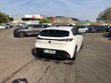 a white car parked in a parking lot next to other cars