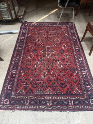 an image of a red rug on the floor in a room