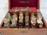 an old wooden box filled with bottles of different types of medicine