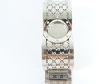a close up of a watch on a white surface