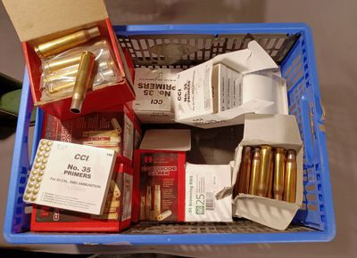 a blue basket filled with different types of ammo