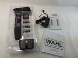 an image of a wahl hair clipper and comb