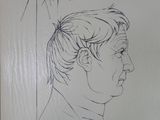 drawing of a man ' s profile with a handwritten message on it