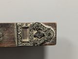 a wooden cross with a metal latch on it