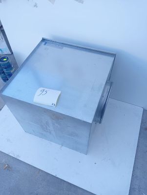 a metal box with a sticker on it sitting on the floor
