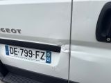 a close up of a white van with a number plate on it