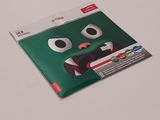 a sticker with a green monster face on it