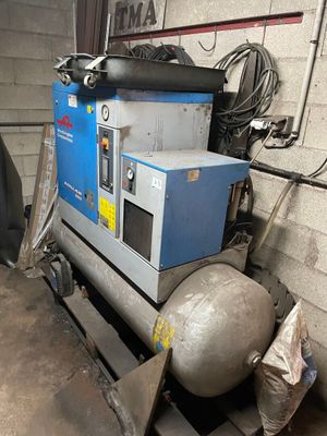 a machine that is sitting on a pallet in a garage