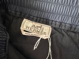 a close up of a label on the back of a black jacket