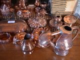 a table with a lot of silver items on it