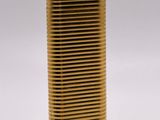 brass plated vase with wavy design on a white background