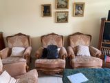 four chairs and a table in a living room